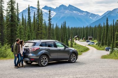 “Travelers arriving at a Canadian national park near a trailhead with forest and mountain scenery in the background.”